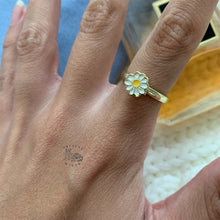 Load image into Gallery viewer, Adjustable gold fidget ring on woman's hand with daisy flower design for anxiety relief and stress management