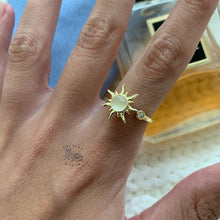 Load image into Gallery viewer, Adjustable gold fidget ring on woman's finger with gold sun design for anxiety relief and stress management