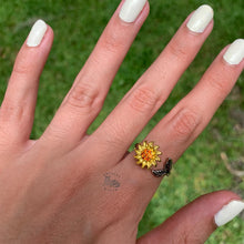 Load image into Gallery viewer, Adjustable silver engraved fidget ring on woman's hand with sunflower design for anxiety relief and stress management